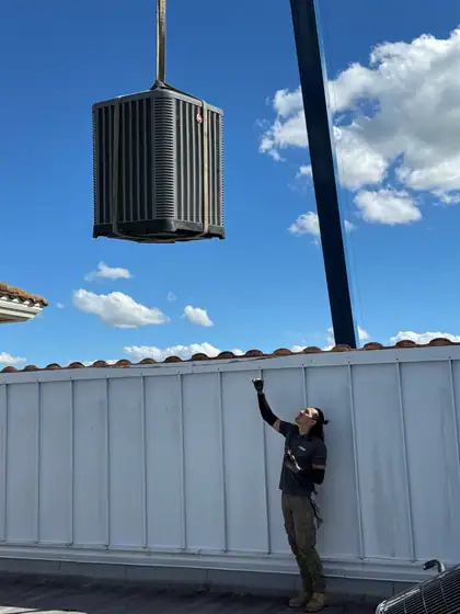 Guiding a new condenser onto the roof